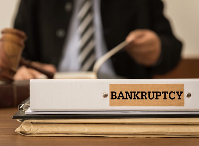 Law Office of Tipton-Downie | Attorney at Law | Vidalia, GA | Bankruptcy document folder with lawyer work at law firm. concept of bankruptcy law, bankrupt,bankruptcy court